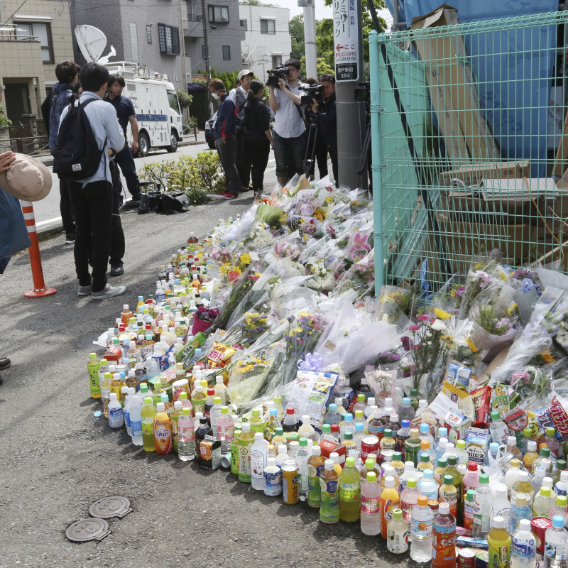 A man prays for victims at the site where a knife attack took place in Kawasaki near Tokyo Wednesday, May 29, 2019. A man carrying a knife in each hand attacked a group of schoolgirls waiting at a bus stop just outside Tokyo Tuesday. (ANSA/AP Photo/Koji Sasahara) [CopyrightNotice: Copyright 2019 The Associated Press. All rights reserved.]