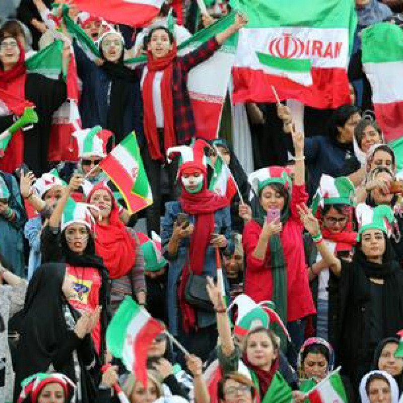 epa07910115 Iranian women cheer during the FIFIA World Cup qualification match between Iran and Cambodia, at the Azadi stadium in Tehran, Iran 10 October 2019. Media reported that thousands of Iranian women are set to watch a men's FIFA Asian World Cup qualifier in a stadium for the first time in 40 years. FIFA president Gianni Infantino on 19 September 2019 released a statement calling for women to be allowed into football stadiums in Iran. The statement added that the situation is 'unacceptable' and that FIFA is expecting positive developments from the Iranian Football Federation (FFIRI) and Iranian authorities starting by the next Iran home match in October 2019. Iran has barred women from attending sports stadiums after its 1979 Islamic Revolution. EPA/ABEDIN TAHERKENAREH
