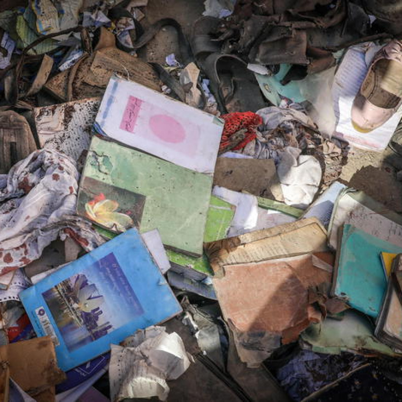 epa09186765 Bloodstained books and notebooks of students are seen on the ground at the scene of a bomb explosion that targeted a school in the west of Kabul, Afghanistan, 09 May 2021. An explosion near a school in Dasht-e-Barchi area west of Kabul killed at least 50 people and left over 100 injured, according to the Ministry of Interior. EPA/HEDAYATULLAH AMID