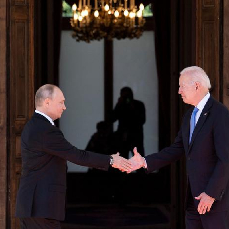 TOPSHOT - Russian President Vladimir Putin (L) shakes hands with US President Joe Biden prior to the US-Russia summit at the Villa La Grange, in Geneva on June 16, 2021. (Photo by Brendan Smialowski / AFP)