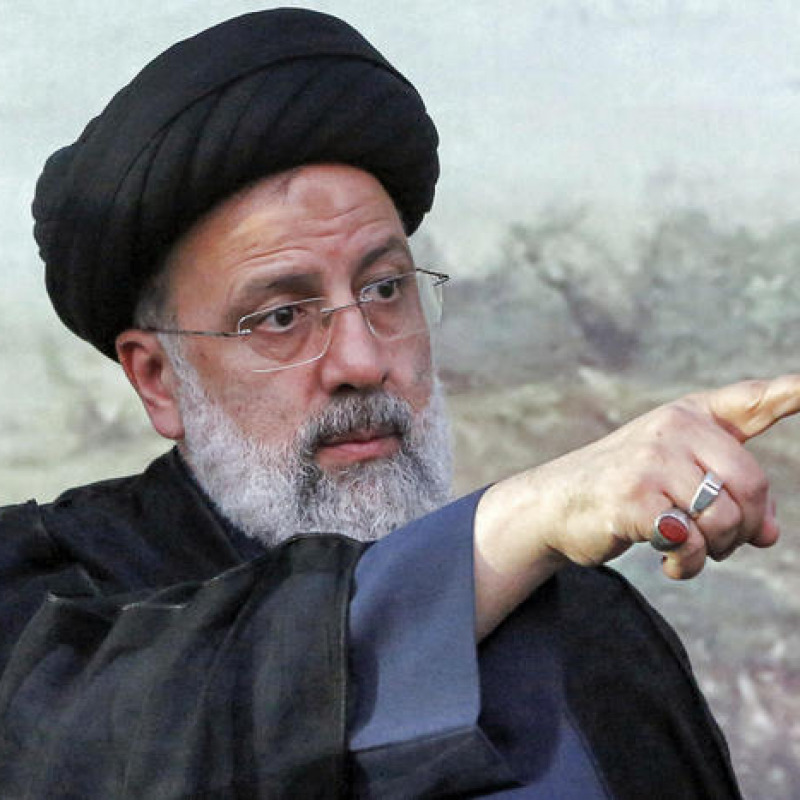 (FILES) In this file photo taken on June 06, 2021 Iranian presidential candidate Ebrahim Raisi gestures during an election campaign rally in the city of Eslamshahr, about 25 kilometres south of the centry of the capital Tehran. - Iran's ultraconservative cleric Ebrahim Raisi won 62 percent of the vote counted so far in a presidential election, officials said today after Raisi's rivals conceded defeat. Raisi won over 17.8 million votes out of 28.6 million ballots counted so far, far ahead of the second-placed candidate Mohsen Rezai who won 3.3 million votes, election office chairman Jamal Orf said on state television after Friday's vote. (Photo by - / AFP)