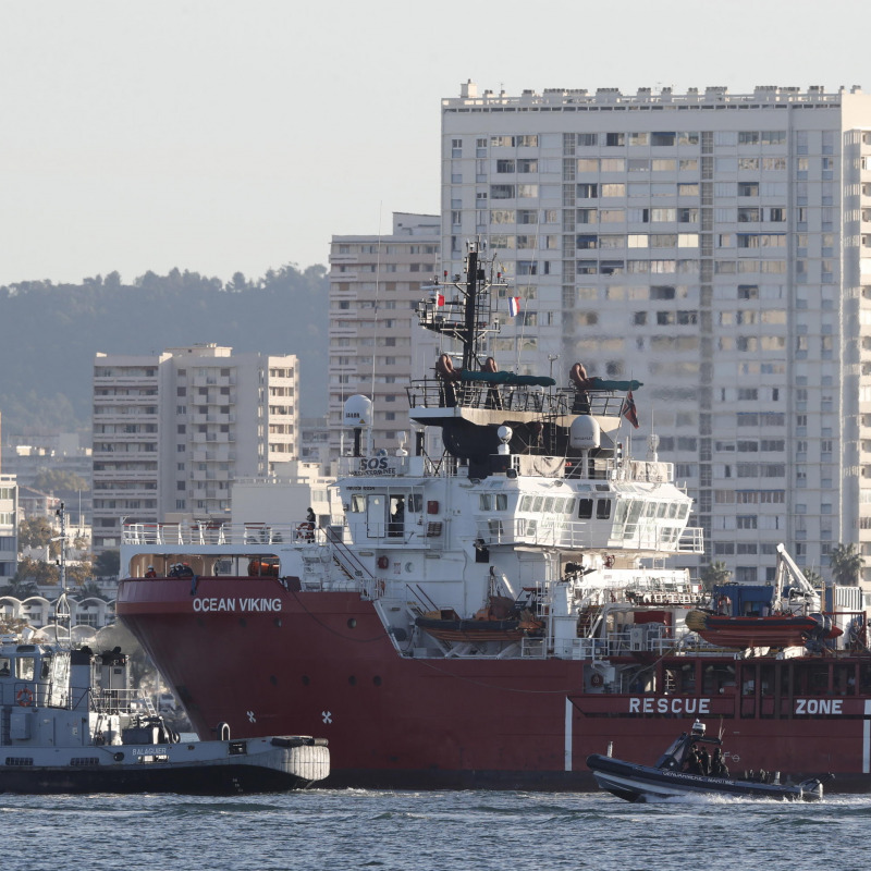 The Ocean Viking rescue ship (C), operated by French maritime-humanitarian organization SOS Mediterranee, enters the harbor escorted by a military boat (L), in Toulon, France, 11 November 2022. SOS Mediterranee on 10 November announced receiving the green light by French authorities to allow the over 230 migrants onboard to disembark in Toulon. The vessel spent weeks at sea after rescuing migrants during several operations throughout October. ANSA/GUILLAUME HORCAJUELO