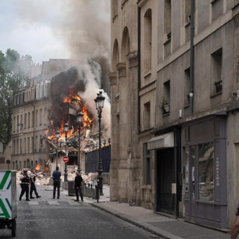 TOPSHOT - Smoke rises from a building Place Alphonse-Laveran in the 5th arrondissement of Paris, on June 21, 2023. (Photo by ABDULMONAM EASSA / AFP)