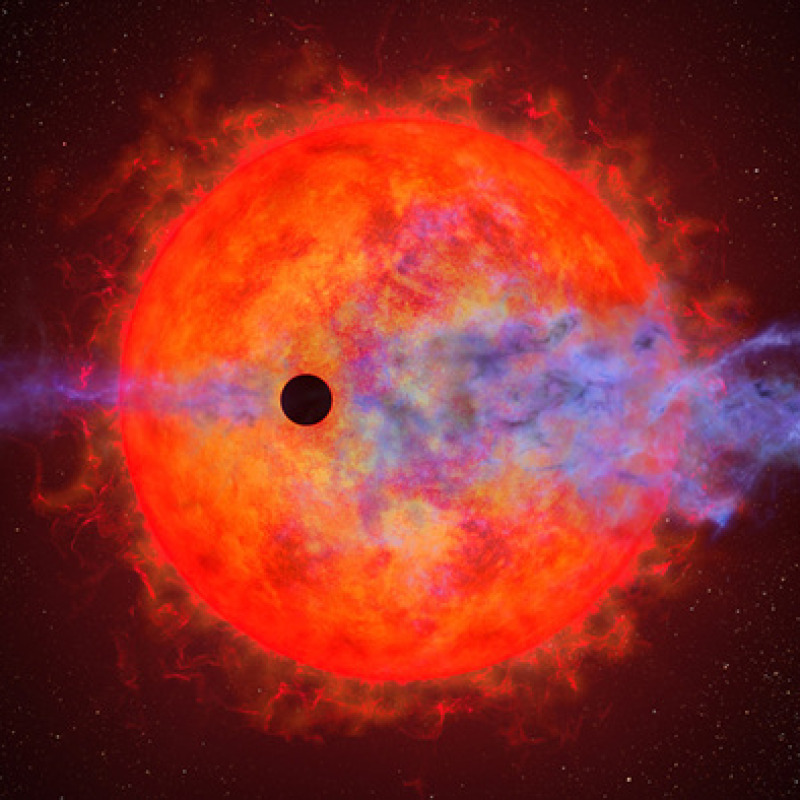 Rappresentazione artistica del pianeta AU Mic b che sta perdendo la sua atmosfera a causa dell'intensa attività della sua stella, AU Microscopii (fonte: NASA, ESA, and Joseph Olmsted (STScI))