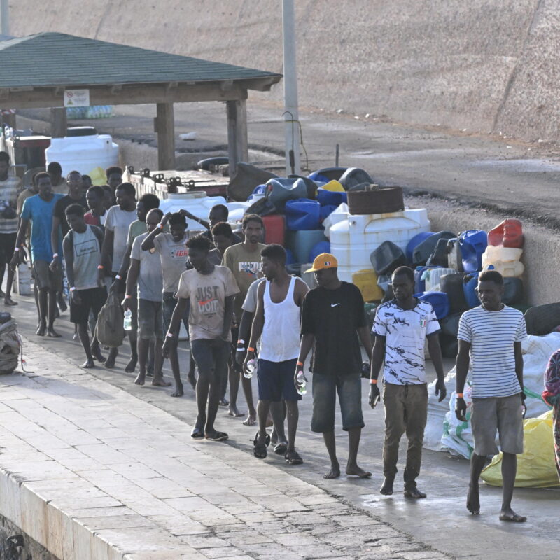 Migrants arrive at 'Molo Favarolo' in Lampedusa, southern Italy, 17 September 2023. The small boat they were traveling was rescuedby the Coast Guard. The group, after the health triage, will be transferred to the hotspot where, at the moment, there are 1,104 guests. ANSA/CIRO FUSCO