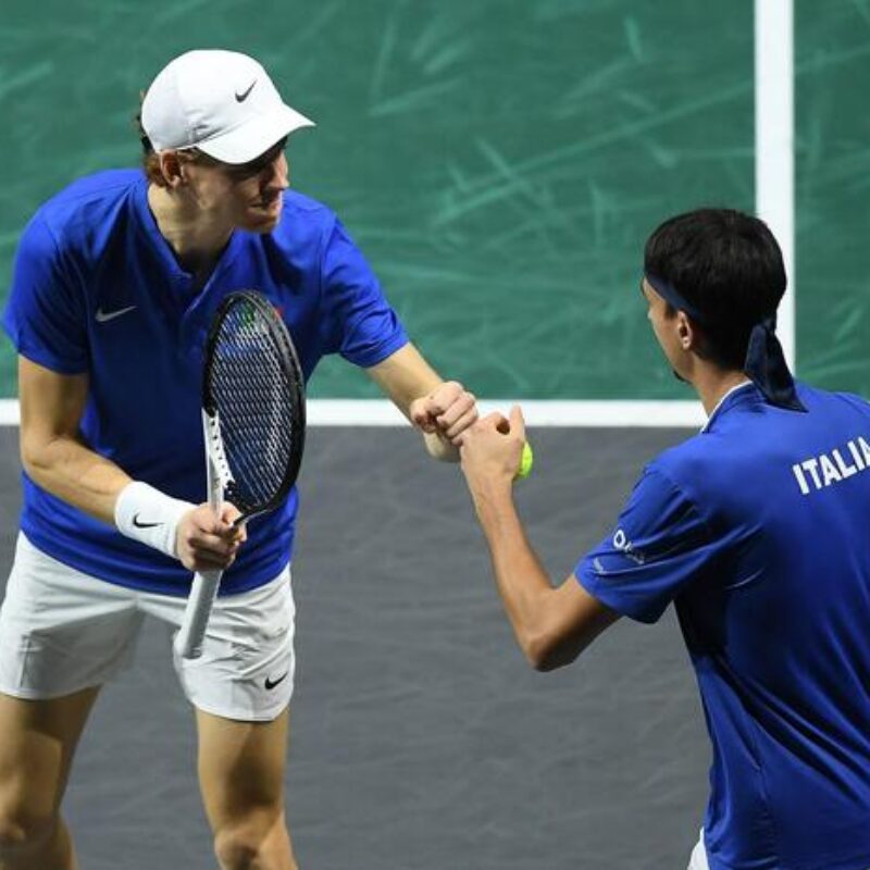 Italy's Jannik Sinner (L) and Lorenzo Sonego take part in the men's doubles semifinal tennis match between Italy and Serbia of the Davis Cup tennis tournament at the Martin Carpena sportshall, in Malaga on November 25, 2023. (Photo by JORGE GUERRERO / AFP)