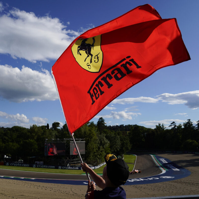 A fan with a Ferrari flag celebrates the best time scored by Charles Leclerc of Monaco and Ferrari SF-24 during the Free Practice of the Formula 1 Gran Premio del Made in Italy e dellEmilia-Romagna at Enzo e Dino Ferrari Circuit on May 17 2024 in Imola, Italy.ANSA/DANILO DI GIOVANNI