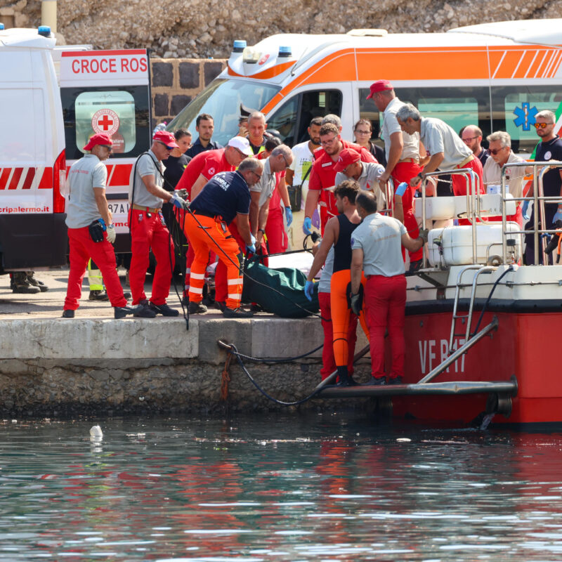 Ambulances with health workers wait on the pier to rescue the seven missing people who were on board the sailing boat that sank at dawn this morning in Palermo, Sicily, Italy, 19 August 2024. A 56-meter-long luxury sailboat, the Bayesian, with 22 people on board, sank at dawn on Monday off Porticello, near Palermo, after a tornado hit the area. At least six missing, one dead in Palermo shipwreck ANSA/IGOR PETYX