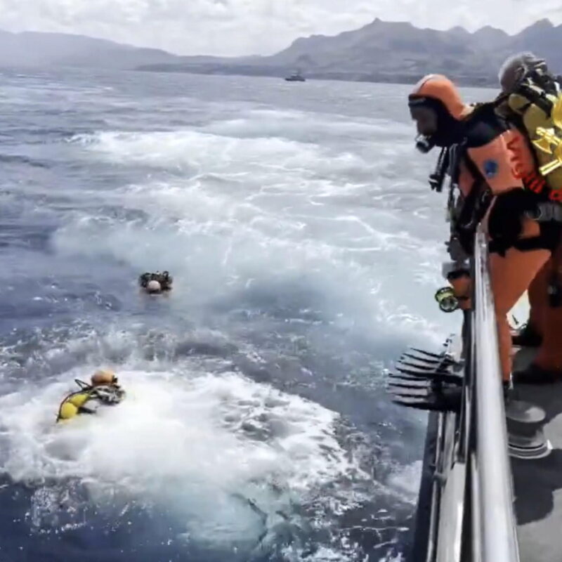 epa11556447 A handout video grab made available by Vigili del Fuoco shows cave divers from the Italian fire brigade as they prepare to resume inspections of the Bayesian yacht's wreck, off the coast of Sicily island, southern Italy, 20 August 2024. At least one person died, six remain missing and 15 passengers were rescued, after a 56-meter-long luxury sailboat, the Bayesian, with 22 people on board, sank on 19 August off Porticello, near Palermo, after a tornado hit the area. The six missing people have not yet been identified as dive teams are trying to find access into the yacht's cabins, sitting at 50 m below the surface of the water. Divers face considerable difficulties at this depth, carrying out 10-minute searches per dive, Luca Cari, head of emergency communications of the general command of the Fire Brigade, said. EPA/VIGILI DEL FUOCO HANDOUT HANDOUT EDITORIAL USE ONLY/NO SALES