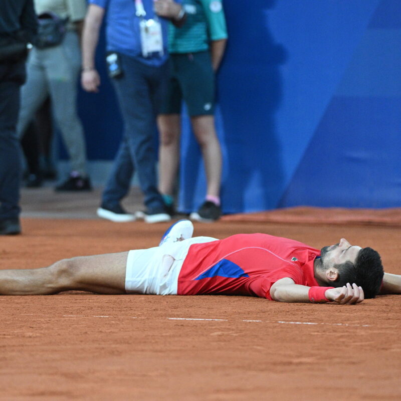 epa11520469 Novak Djokovic of Serbia celebrates after winning against Lorenzo Musetti of Italy (unseen) during their Men's singles semi final match at the Tennis competitions in the Paris 2024 Olympic Games, at the Roland Garros in Paris, France, 02 August 2024. EPA/CAROLINE BLUMBERG