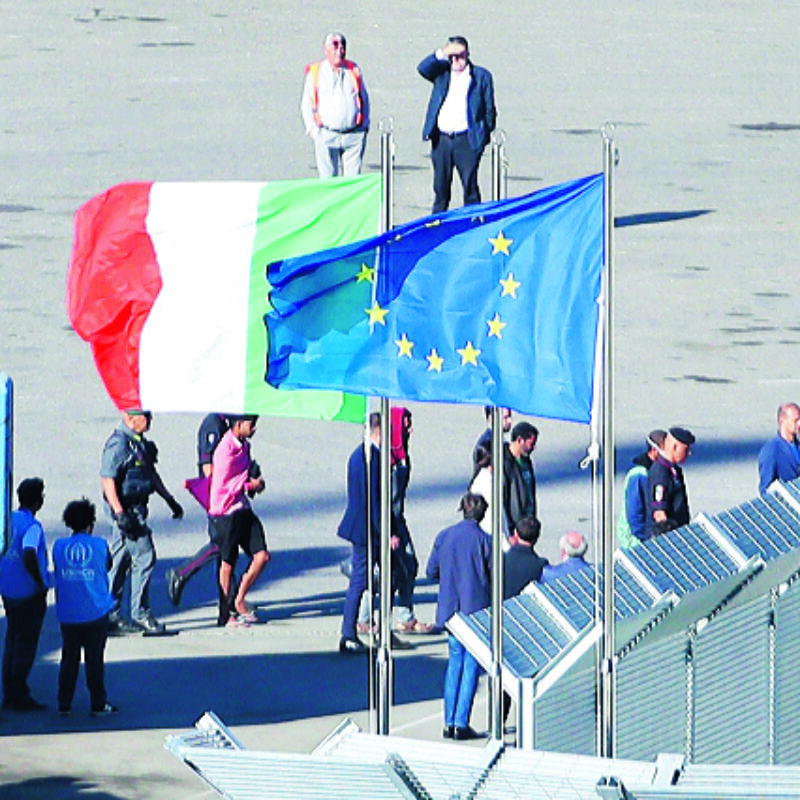 epaselect epa11661890 A group of migrants intercepted in Italian waters arrive aboard an Italian navy boat at Shengjin, Albania, 16 October 2024. Italy has begun sending migrants rescued in the Mediterranean to detention centers in Albania, where their asylum claims will be processed. The plan, finalized in February 2024, allows Italy to transfer up to 36,000 asylum seekers to Albania annually, with the goal of deterring migrants from attempting to reach Italy. While the Italian government and some EU leaders support the program, human rights groups criticize it for potentially putting migrants at risk and exposing them to rights violations. EPA/MALTON DIBRA