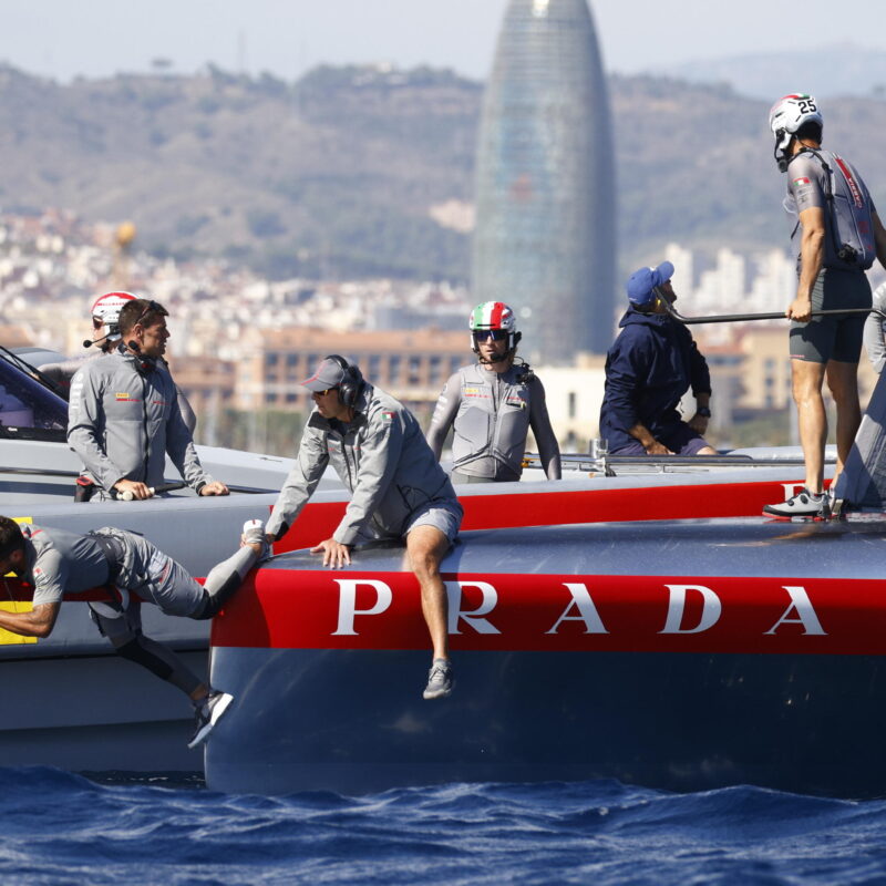 epa11635842 Team Prada Luna Rossa Pirelli crew makes repairs in the boat after retiring from the first leg during Day 5 in the 2024 Louis Vuitton Cup final in Barcelona, Spain, 01 October 2024. The winner of the Louis Vuitton Cup sailing competition determines the challenger in the 37th America's Cup to be held in October. EPA/Quique Garcia