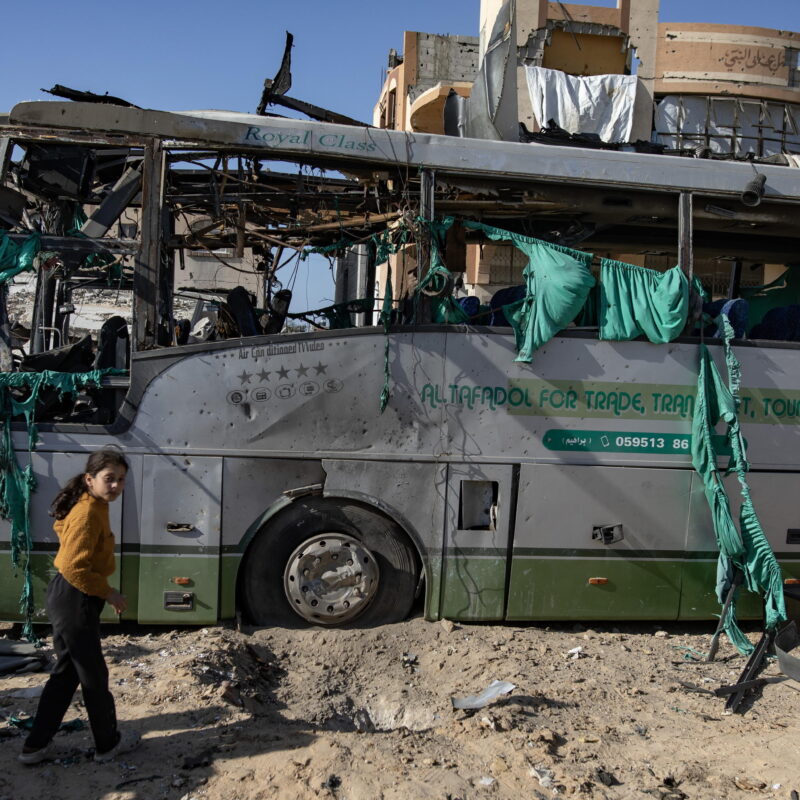 epa11791012 Palestinians inspect a bus hit by an Israeli airstrike in Khan Yunis, southern Gaza Strip, 23 December 2024. At least two people were injured in an Israeli airstrike on a bus in Khan Yunis, according to medics at Nasser Hospital. More than 45,000 Palestinians and over 1,400 Israelis have been killed, according to the Palestinian Health Ministry and the Israeli Army, since Hamas militants launched an attack against Israel from the Gaza Strip on 07 October 2023, and the Israeli operations in Gaza and the West Bank which followed it. EPA/HAITHAM IMAD