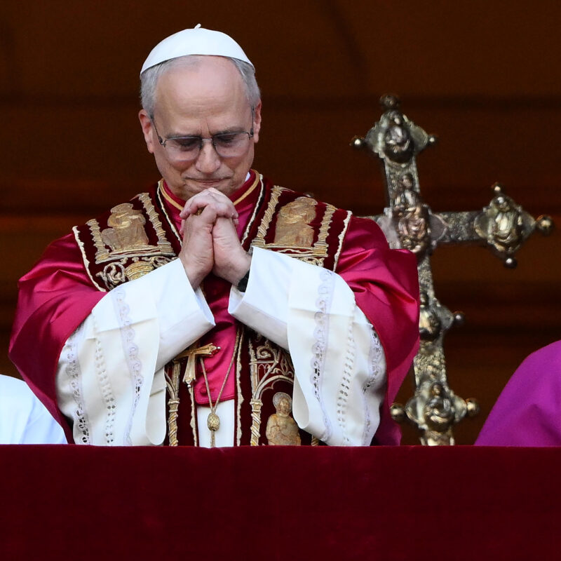 Cardinal Robert Francis Prevost prays from a balcony of St Peter's Basilica after his election as the 267th pope of the Roman Catholic church, Vatican City, 08 May 2025. ?NSA/ETTORE FERRARI