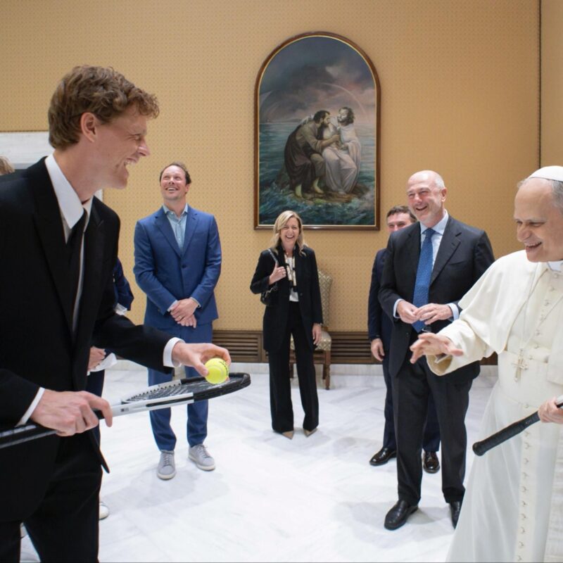 A photo distributed by Vatican Media shows Italian tennis player Jannik Sinner giving a tennis racket to the Pope. The champion had his own and a ball and asked Leone: "Do you want to play?" The Pope showed him the room with lamps and other furniture and laughingly replied: "Let's leave it, it's better not to here". Leone also added laughing: "At Wimbledon they would let me...", meaning that on the famous British court they would let him play with the new racket. Rome, 14 May 2025. ANSA / VATICAN MEDIA HANDOUT