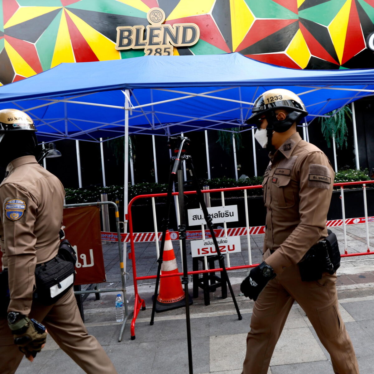 epa13107746 Thai police officers secure the area near a pub that was the scene of a fatal fire, in Bangkok, Thailand, 13 July 2026. At least 27 people were killed after a fire engulfed the pub, according to Thai Prime Minister Anutin Charnvirakul. EPA/RUNGROJ YONGRIT